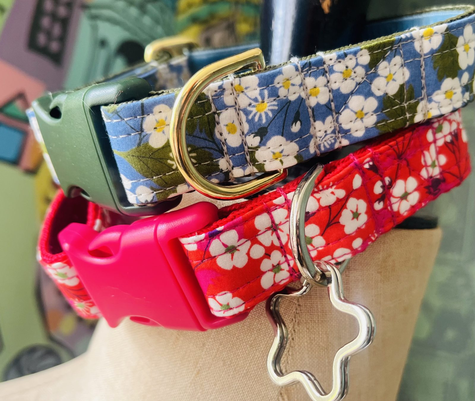 Close up of handmade floral dog collars in blue and red patterns